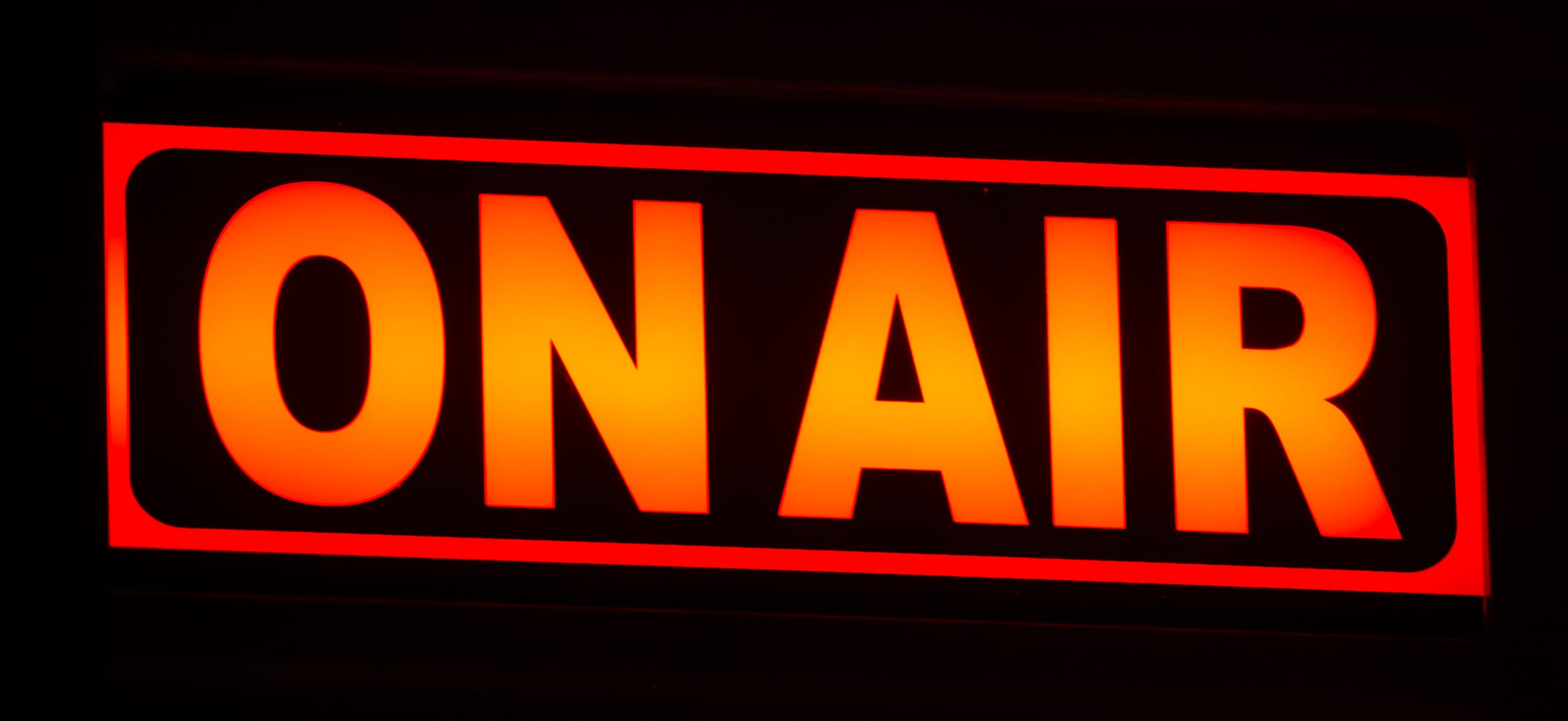 On-air neon glow in a radio studio